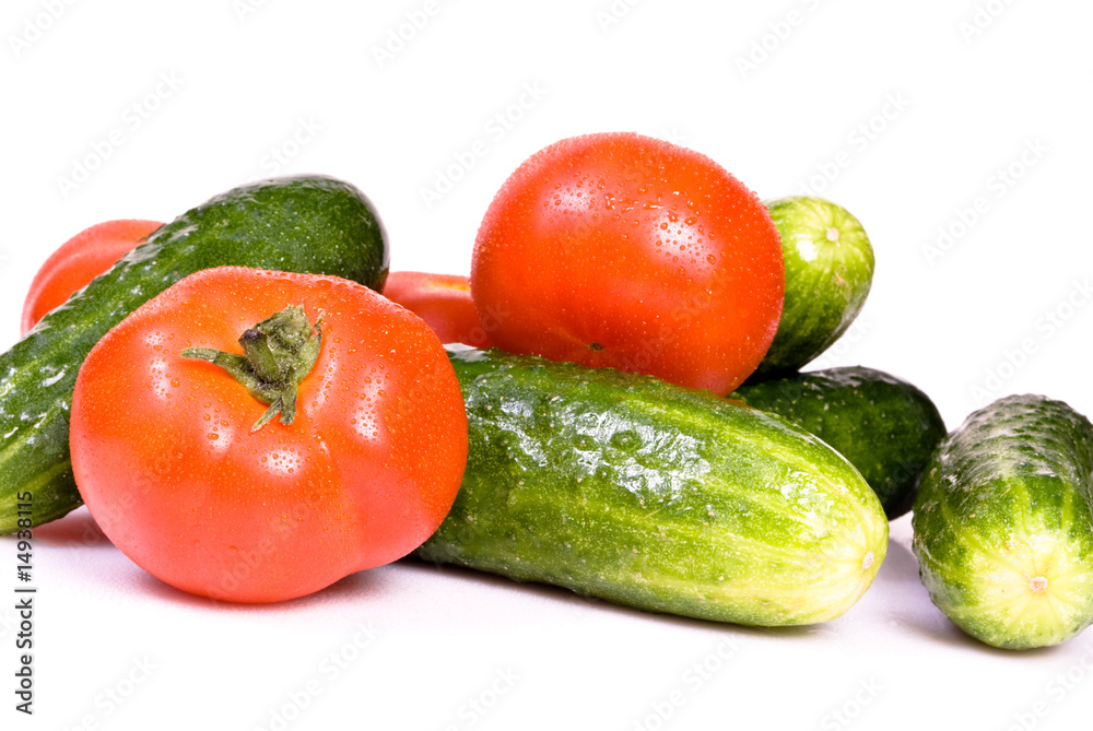 Cucumbers and tomato, isolated on white background Cucumbers and tomato, isolated on white background