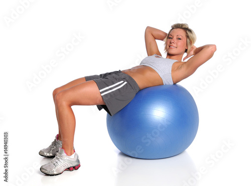 Woman Exercising On Fitness Ball