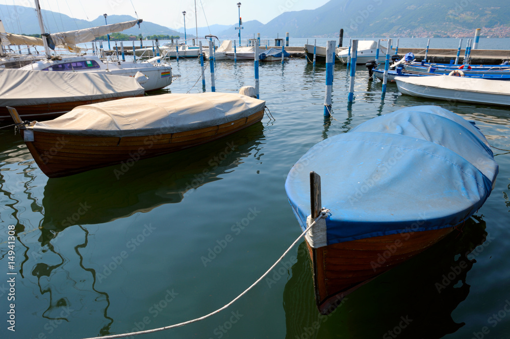 Covered boats moored in the marina at Iseo, Lombardy, Italy