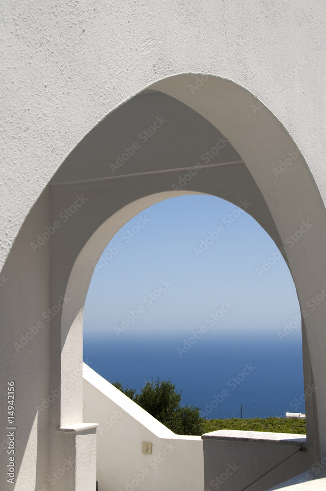 classic greek island architecture with arches and sea view