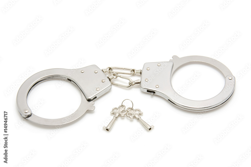 Closed handcuffs isolated on white background Closed handcuffs isolated on white background
