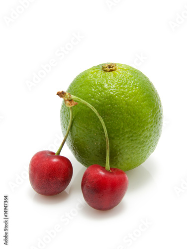 cherries and lime isolated on white background