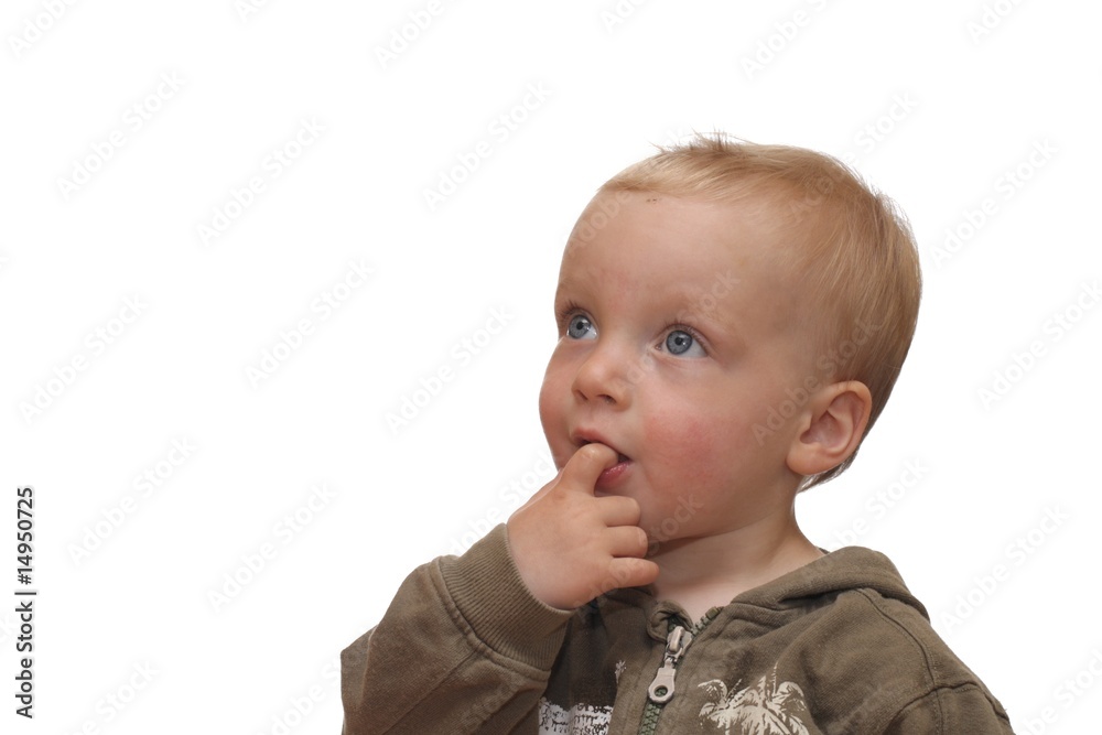 Nettes Kleinkind mit Finger im Mund Nettes Kleinkind mit Finger im Mund
