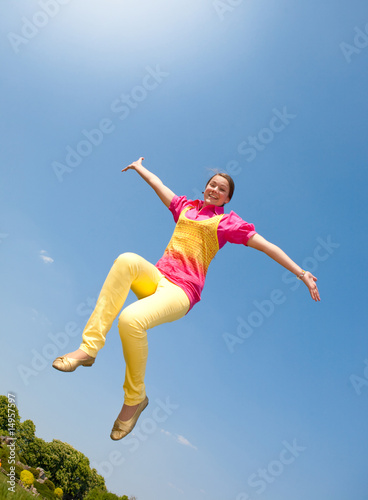Happy smiling girl - jumping.