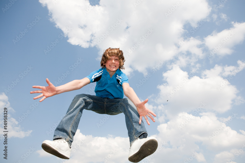 Happy jumping boy. Soft focus. Focus on eyes Happy jumping boy. Soft focus. Focus on eyes