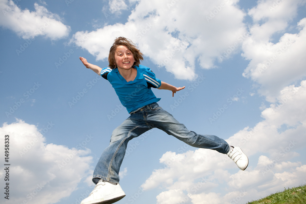 Happy jumping boy. Soft focus. Focus on eyes Happy jumping boy. Soft focus. Focus on eyes