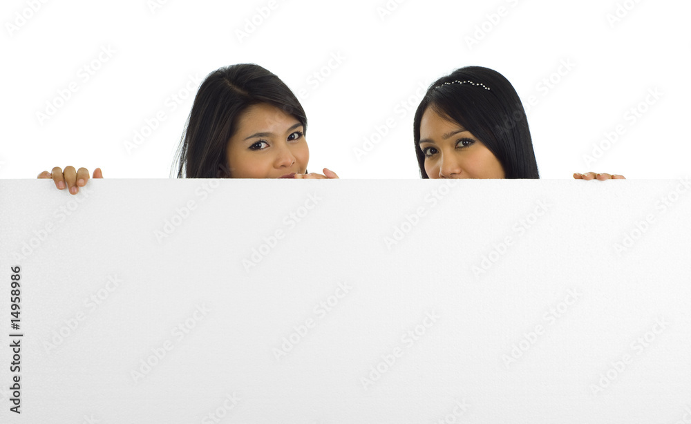 two beautiful asian women with a white board two beautiful asian women with a white board