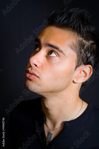 One young man looking up and above him