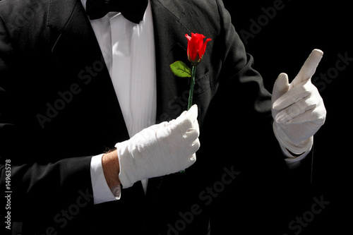 young magician performing red rose