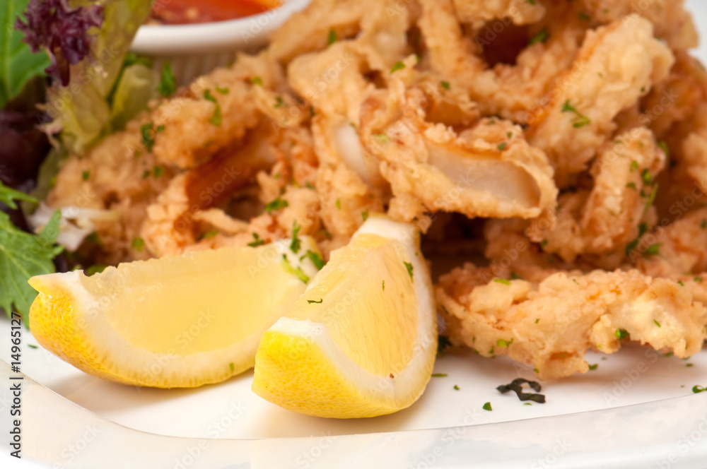 Lemons and fried calamari Lemons and fried calamari