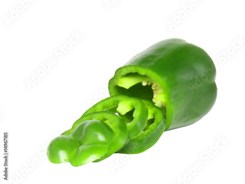 Cutting green sweet pepper on white background. Isolated
