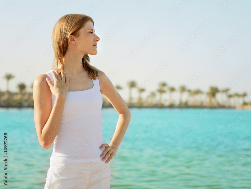 Beautiful young woman relaxing on the beach