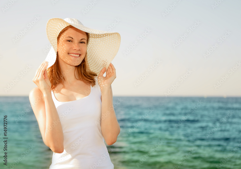 Attractive young woman in a hat