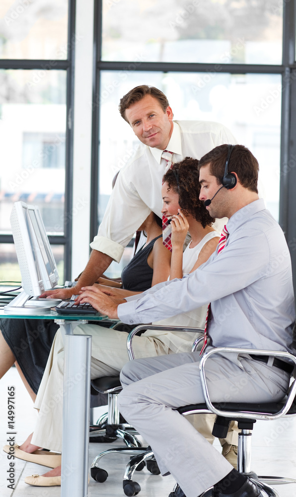 Senior manager in a call center looking at the camera Senior manager in a call center looking at the camera