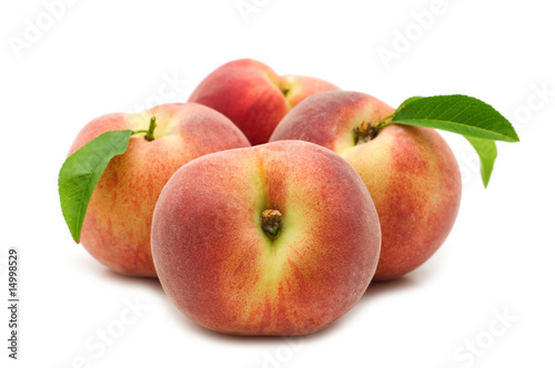 fresh peaches on white background