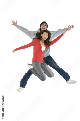 happy casual couple jumping of joy