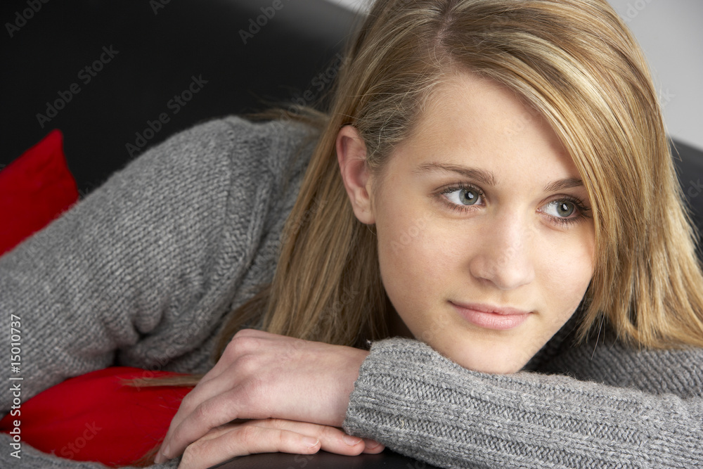 Teenage Girl Sitting On Sofa Teenage Girl Sitting On Sofa