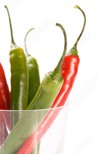 Red and green  chilly peppers in glass