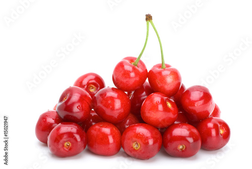 Pile of red cherries without stalks and pair berries on the top