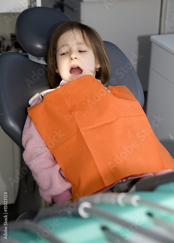Fotografie little girl by dentist
