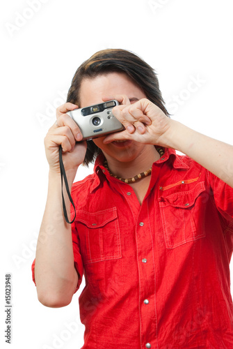 Young guy photographs something.