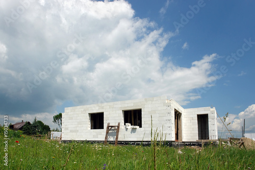 White brick house under construction