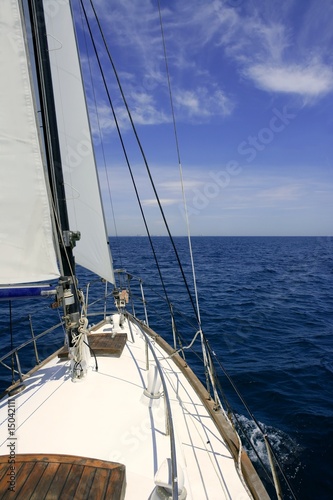 Sailboat sailing blue sea on sunny summer day © lunamarina