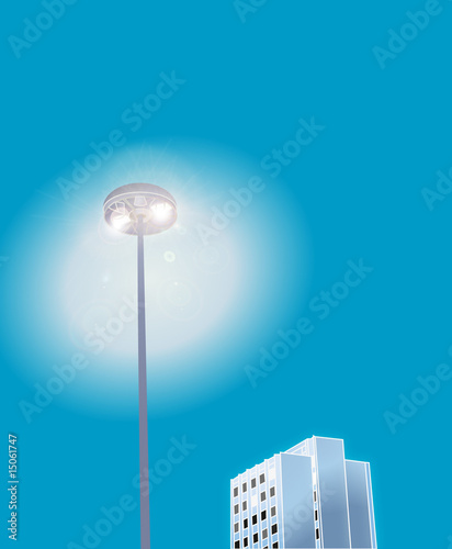 Street lamp and skyscraper at night