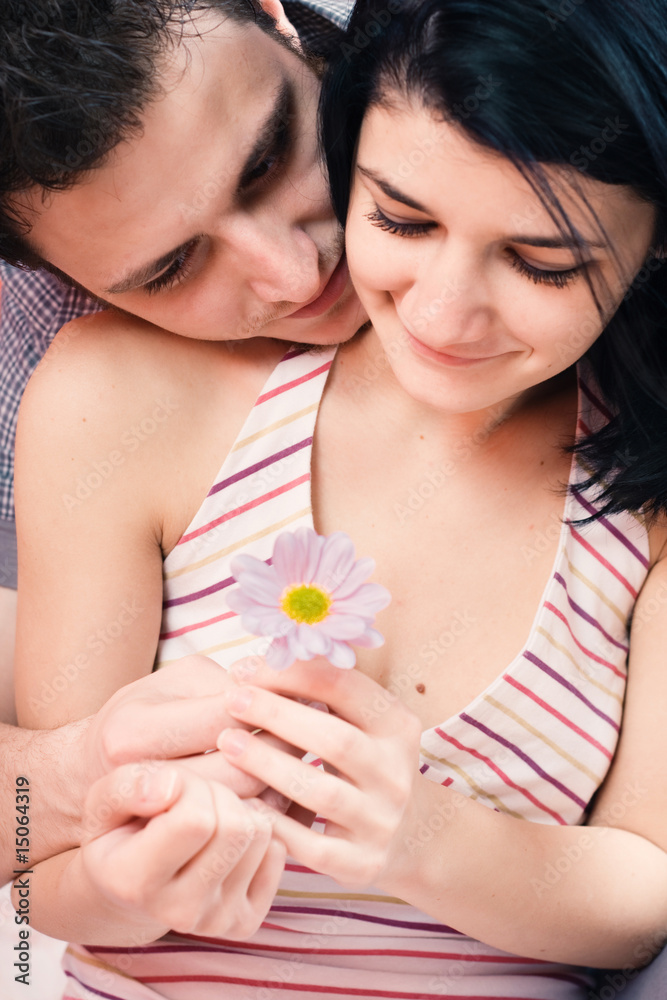 Offering a flower to his loved one Offering a flower to his loved one