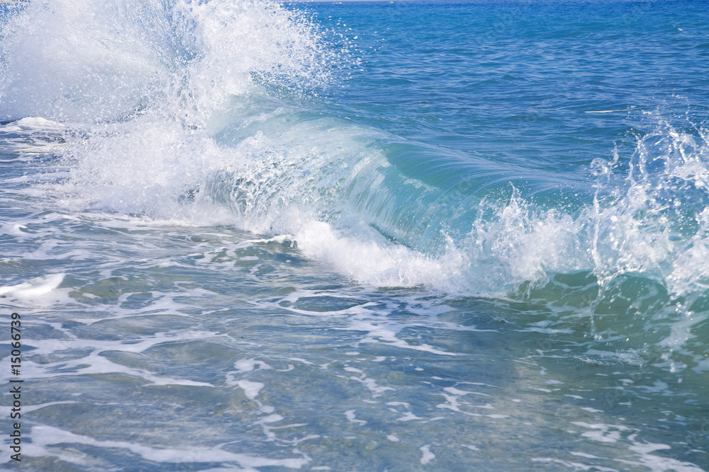 powerful blue foamy wave runs in a coast powerful blue foamy wave runs in a coast