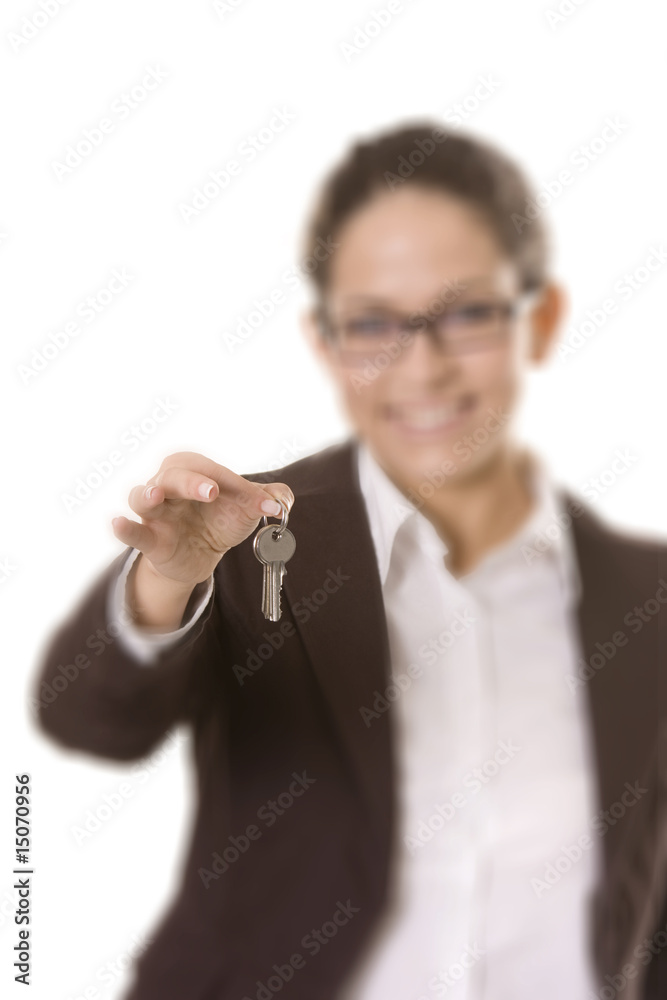Businesswoman holding keys, focus on the keys Businesswoman holding keys, focus on the keys