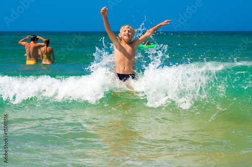 Little boy bathing on the sea