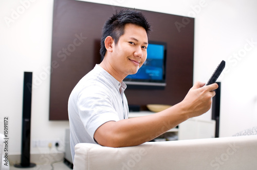 Man watching television at living room