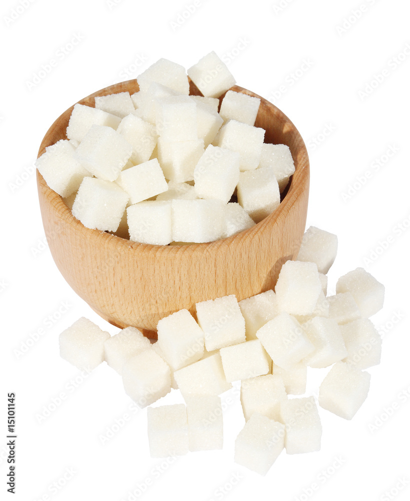 Lump sugar in a wooden mortar on a white background Lump sugar in a wooden mortar on a white background