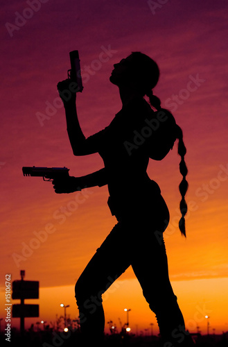 silhouette of girl with guns