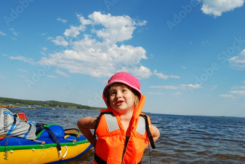 Girl and catamaran photo