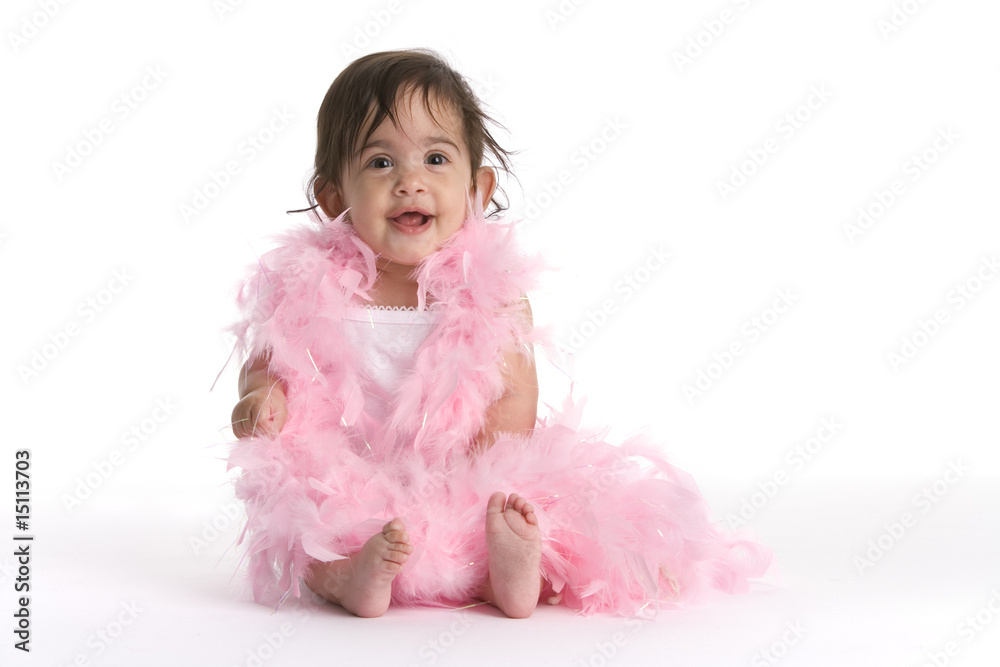 Baby girl with pink feathers and bare feet Baby girl with pink feathers and bare feet