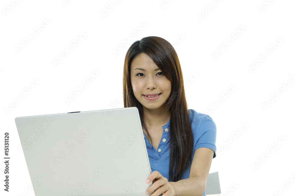 A pretty asian woman working on the laptop A pretty asian woman working on the laptop