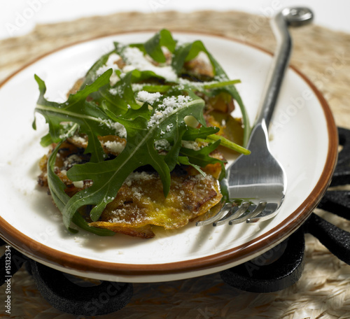 potato omelet with rucola and parmasan photo