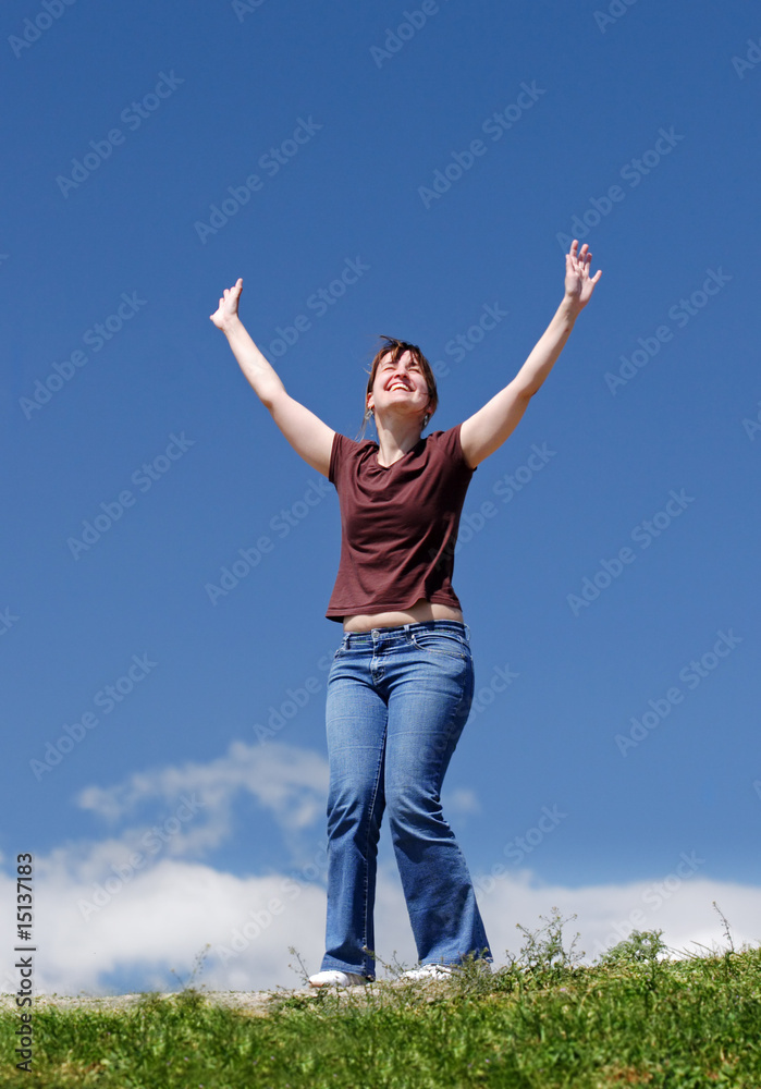 A young happy women laugh with open arm in outdoor A young happy women laugh with open arm in outdoor