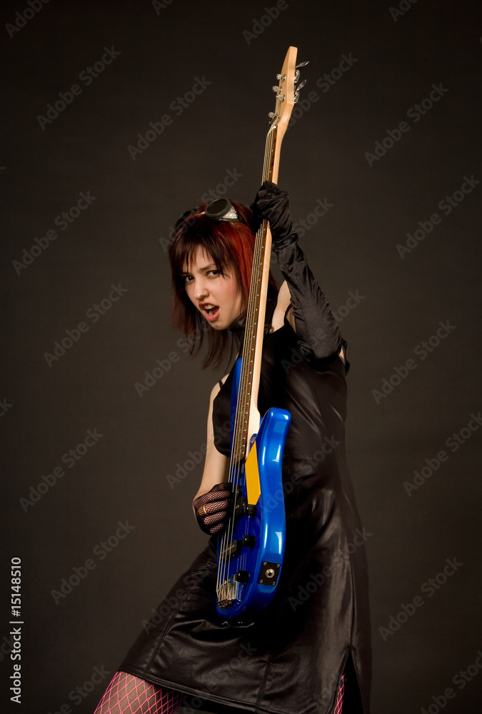 Rock girl with blue bass guitar