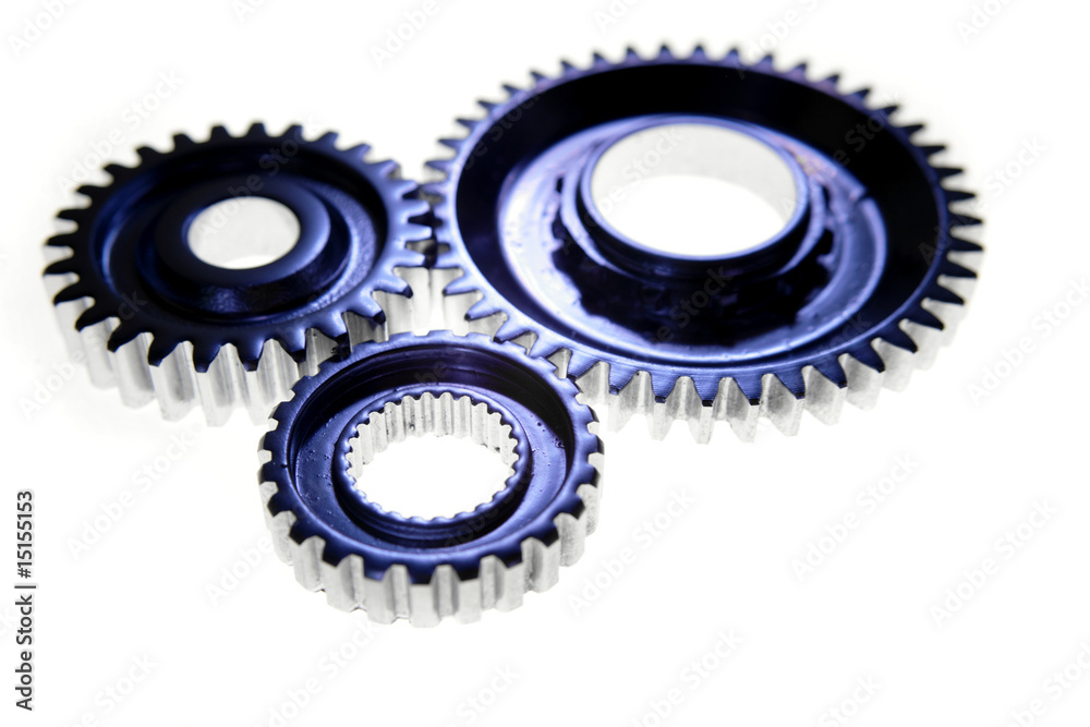 Three steel cogwheels together on white background Three steel cogwheels together on white background