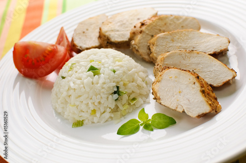 Roasted chicken meat with white rice and vegetables