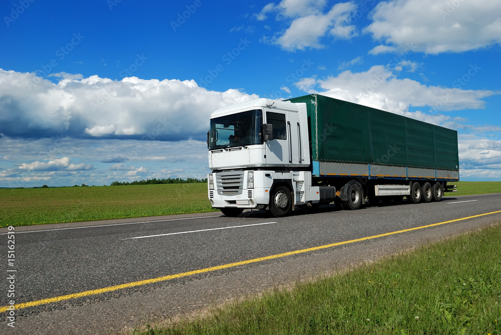 white lorry with green trailer