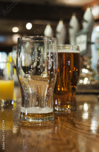 Fototapeta Naklejka Na Ścianę i Meble -  Drinks on bar in a public house, England.