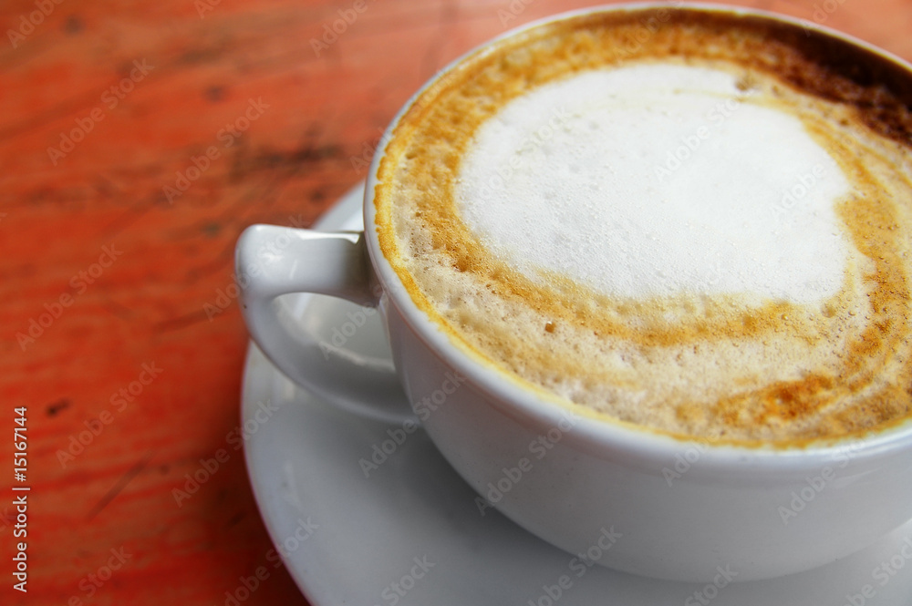 closeup of the top of a cappuccino coffee closeup of the top of a cappuccino coffee