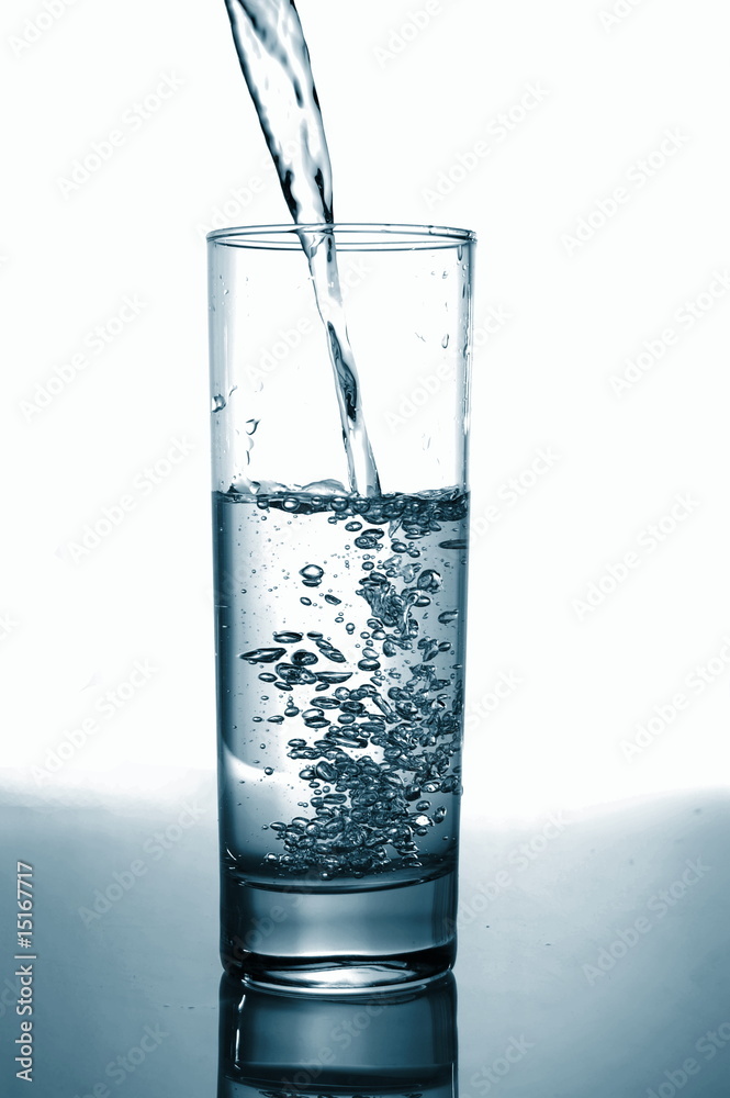 glass of pouring water with reflection glass of pouring water with reflection