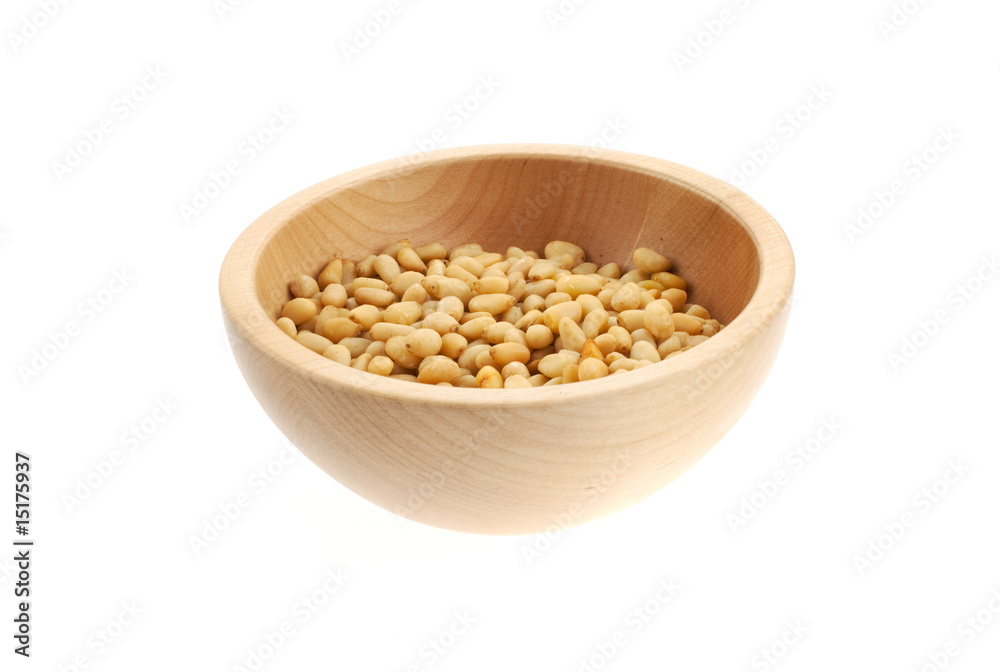 pine nuts in a wood bowl pine nuts in a wood bowl