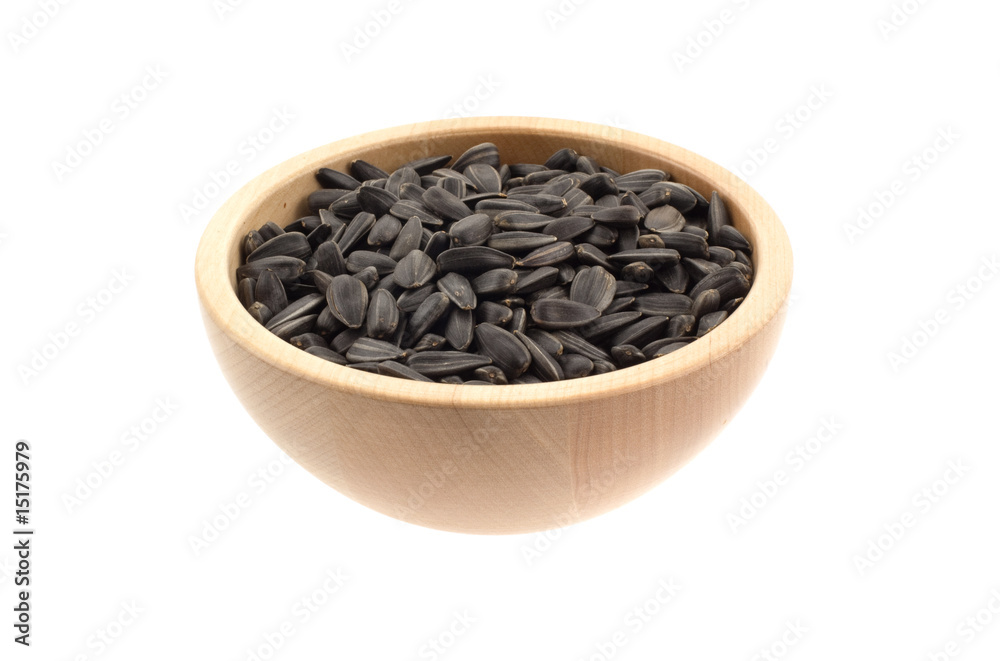 sunflower seeds in a wood bowl sunflower seeds in a wood bowl