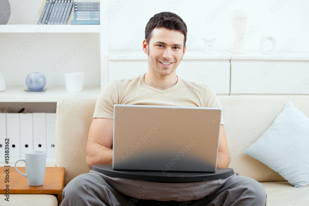 Man browsing internet at home Man browsing internet at home